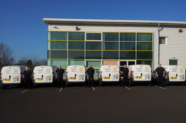 WM Donnelly heating engineers stood next to their vans