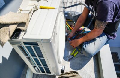 HVAC engineer performing maintenance on cooling system