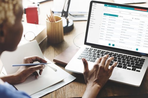 Woman using Joblogic's accounts integration feature
