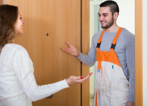 Engineer being greeted at the good by a customer