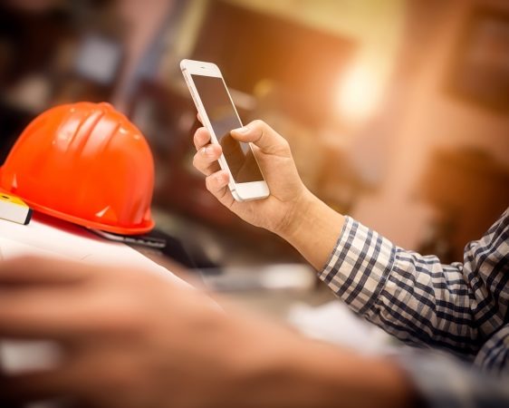 Engineer using a mobile phone