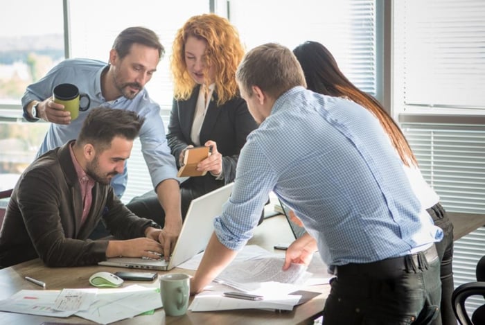 Happy office team working together