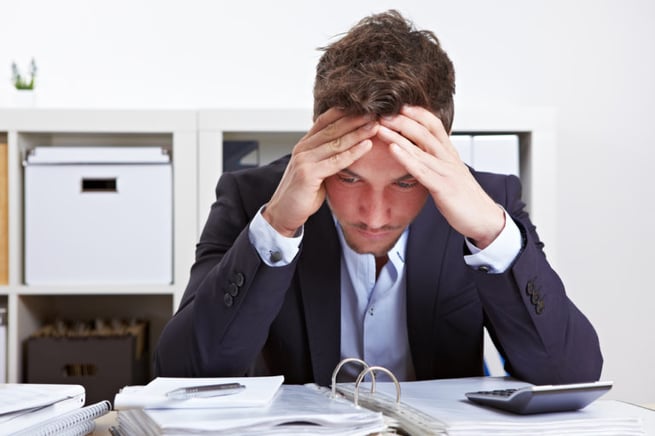 Unhappy looking man in an office